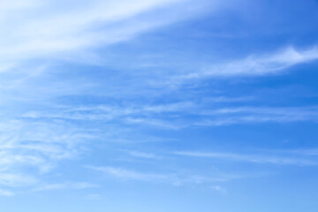 Soft clouds sky on bright blue with vast space background