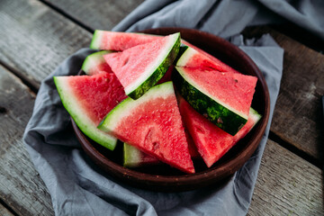 Pieces of watermelon on a wooden table close up