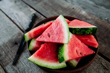 Pieces of watermelon on a wooden table close up