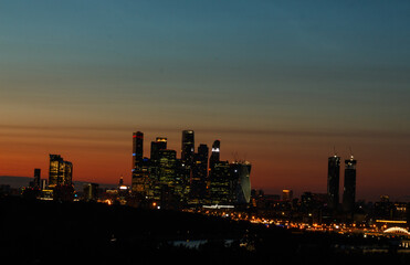 Scenic sunset in Moscow, Russia.  Multicolored sky. Silhouette of Moscow International Business Center