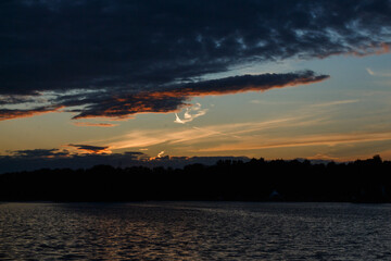 Moscow, Russia.  Picturesque sunset over lake at Kuskovo park. Cold colors