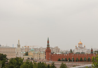 Fototapeta premium Moscow, Russia, The Kremlin wall and Beklemishevskaya Tower. Cathedral of Christ the Saviour in background