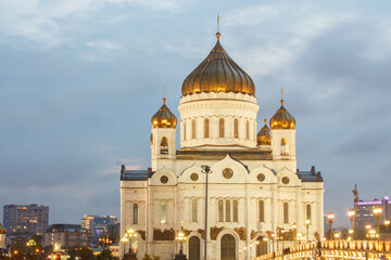 Fototapeta na wymiar Moscow, Russia. Cathedral of Christ the Saviour. View from pedestrian bridge. Evening, backlighting