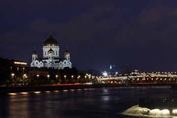 Fototapeta na wymiar Moscow, Russia. Night view of Moscow river near Cathedral of Christ the Saviour. Patriarshy Bridge