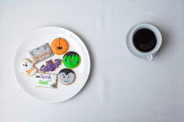 hot coffee cup with funny Halloween Cookies. Happy Halloween day, Trick or Threat, Hello October, fall autumn, Traditional, party and holiday concept