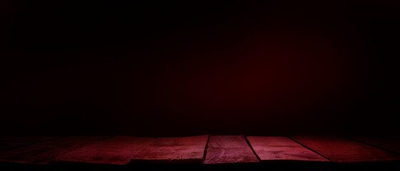 A rustic wood tabletop product display background with copy space and a spooky night red tint.