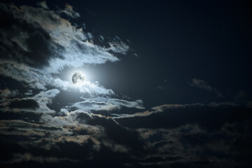 Shining mystical moon on the dark night sky