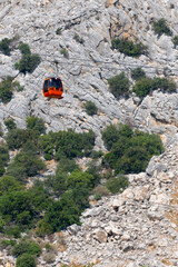 cable car carrying passengers over the mountain, tunektepe, antalya, turkey,