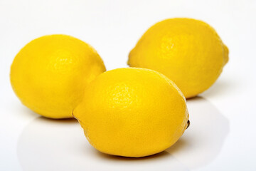 Fresh whole lemons on white background