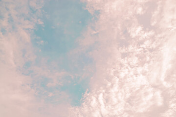 Pink and blue pastel clouds in the sky cute background.