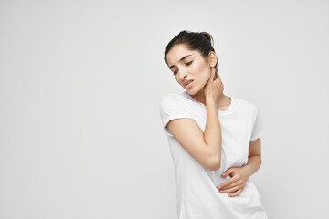 Woman in white t-shirt big discomfort medicine