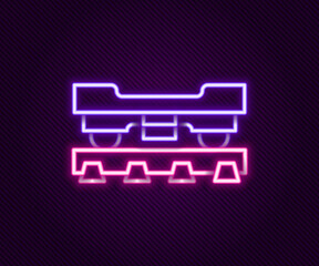 Glowing neon line Cargo train wagon icon isolated on black background. Freight car. Railroad transportation. Colorful outline concept. Vector