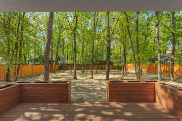 Modern suburban white house in nature among the trees. Backyard of an American home. High quality...