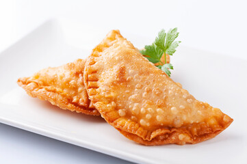 Tuna patty, empanadillas, on white background