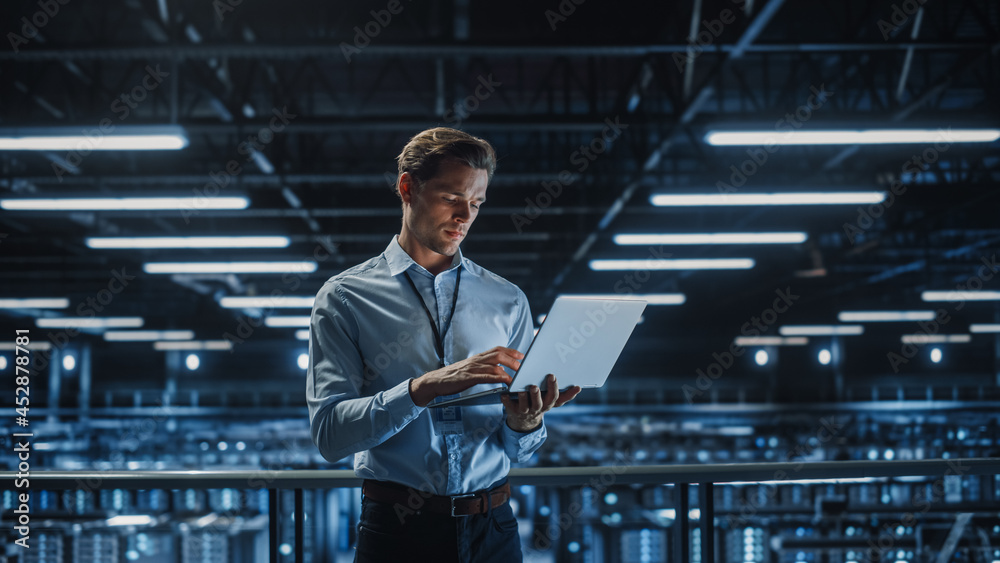Aufkleber Portrait of IT Specialist Uses Laptop in Data Center. Server Farm Cloud Computing Facility with Male Maintenance Administrator Working. Cyber Security and Network Protection.