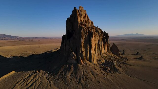 Cinematic aerial shot of iconic monolith in Shiprock in New Mexico