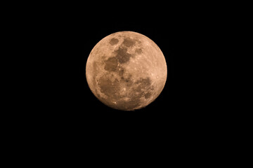 Ninety Nine Percent Full Moon in a hazy smoky night sky