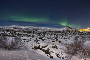 aurora borealis dancing over the mountains