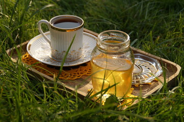 bottle with honey and flowers