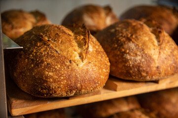 Fresh artisan bread. Loaves of delicious wholesome natural hot bread. Healthy food production and proper nutrition concept