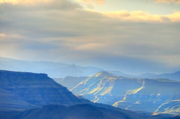 Fototapeta na wymiar DAPPLED SUNLIGHT on peaks of the southern Drakensberg, Underberg, kwazulu Natal, South Africa