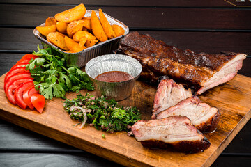 BBQ grilled ribs on a wooden board