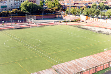 Naklejka premium empty green soccer field to play football in Madrid, Spain
