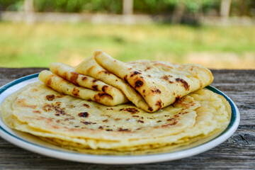 Bakery. Home made pancakes with   organic free range  eggs and white cheese on wooden background. Rustic style breakfast