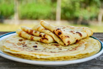 Bakery. Home made pancakes with   organic free range  eggs and white cheese on wooden background. Rustic style breakfast