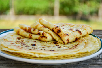 Bakery. Home made pancakes with   organic free range  eggs and white cheese on wooden background. Rustic style breakfast