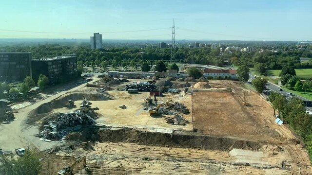 Construction site from above with digger / power showel working, destroyed ware house Eschborn close to Frankfurt
