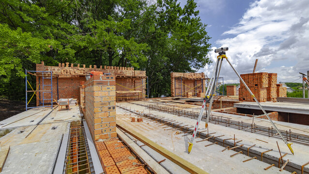 Construction process of new residential building at construction site. High quality photo