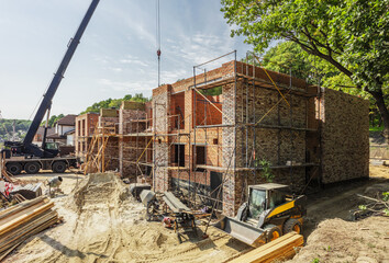 Construction process of new residential building at construction site. High quality photo