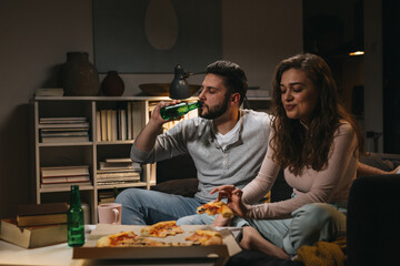 friends eating pizza at home