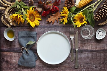 Table scape for Thanksgiving day dinner. Table decoration for festive autumn family party. Rustic style, selective focus