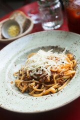 Traditional pasta Bolognese with cheese 
