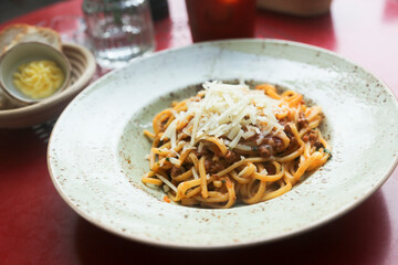 Traditional pasta Bolognese with cheese 