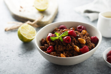 Homemade chocolate granola with raspberry