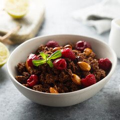 Homemade chocolate granola with raspberry