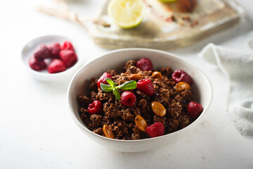 Homemade chocolate granola with raspberry