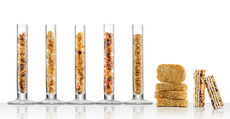 Cereales en tubos de cristal sobre fondo blanco. Cereals in glass tubes on white background.