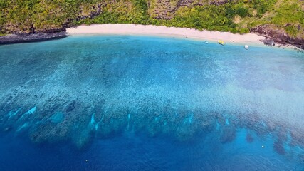 Drone view of white sand beach of Mayotte turquoise lagoon