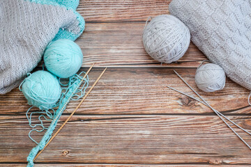 Knitting with needles. Against the background of a tree. handmade