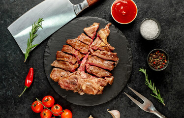 grilled T-bone steak on a stone background
