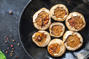 stuffed mushroom mushrooms stuffed baked no meat fresh portion ready to eat meal snack on the table copy space food background rustic. top view keto or paleo diet veggie vegan or vegetarian food