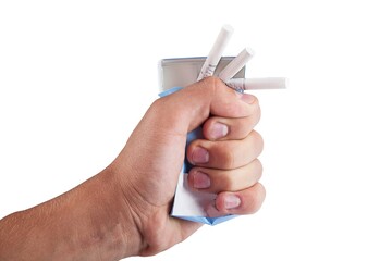Hand crushing a pack of cigarettes