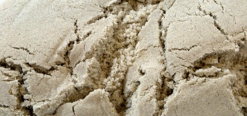 Background for the design. Sand in the cracks