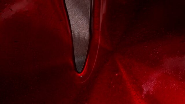 Red syrup fills the stewpan. Dessert making process. High quality FullHD footage