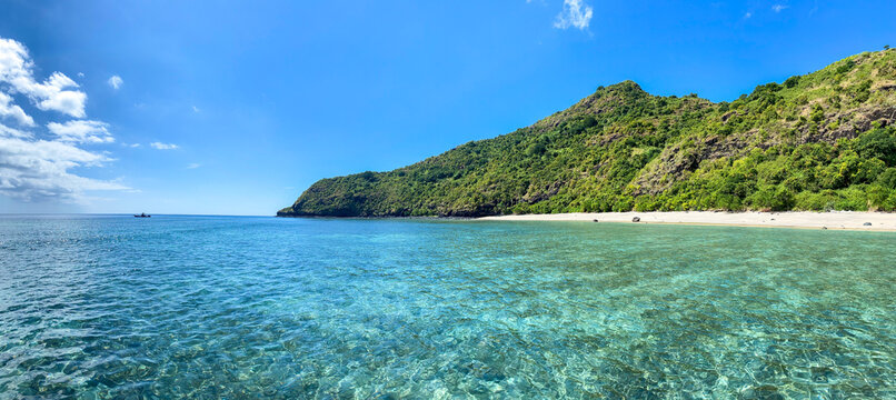 Drone view of white sand beach of Mayotte turquoise lagoon