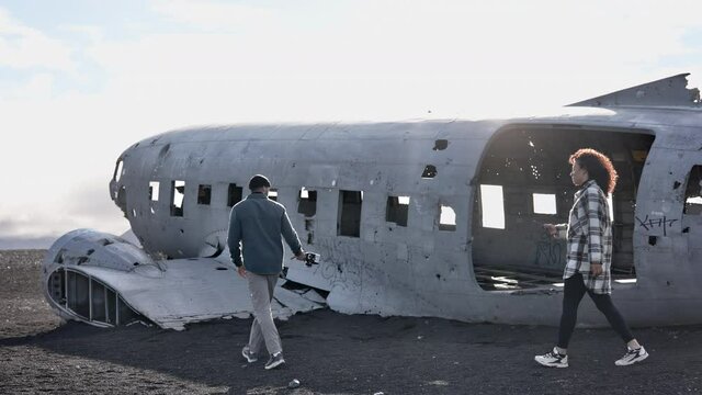 Lovely Scenery Shot of Travelers Outside the Solheimasandur Plane Wreck